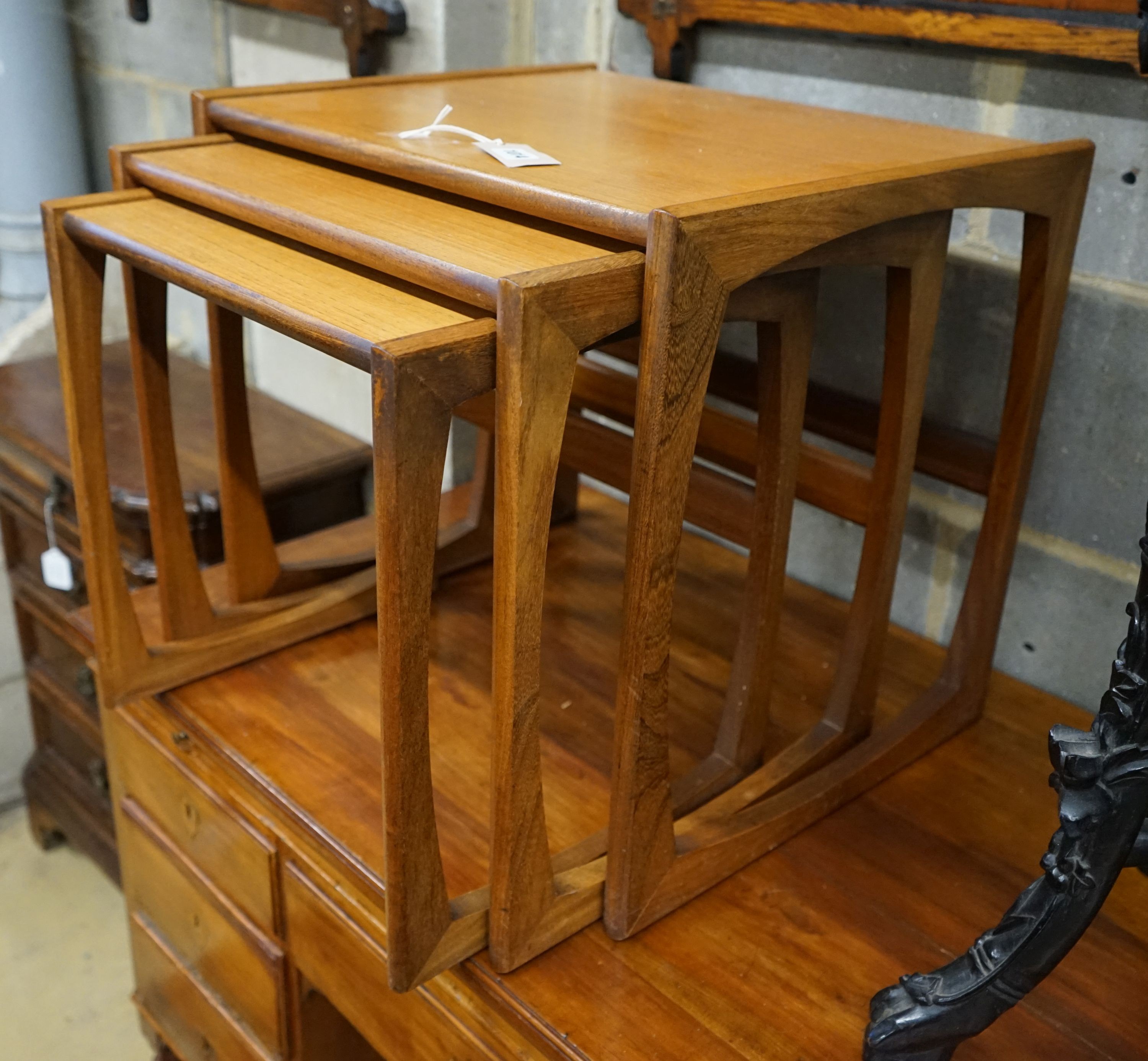 A nest of three rectangular G Plan teak tea tables, width 53cm, depth 43cm, height 48cm